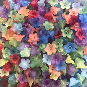 Pastel lucite flower beads in assorted colors, small 5-petal shapes