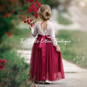 Burgundy long-sleeve flower girl dress with lace bodice and tulle skirt, bow back