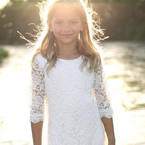 Ivory lace flower girl dress with 3/4 sleeves and round neckline