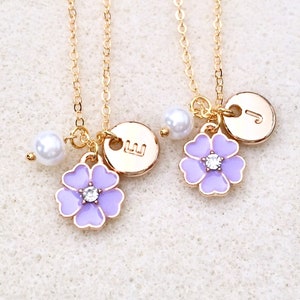 Gold-tone chain necklace with purple flower charms and small white pearl beads