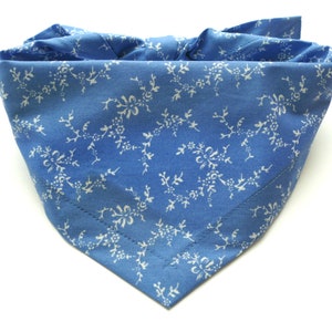 Blue dog bandana with small white floral pattern, triangular neck scarf