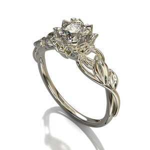 Silver-toned floral engagement ring with a central clear stone flower cluster