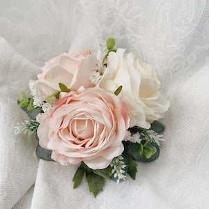 Artificial wedding cake topper with blush peach rose, white blooms, and green foliage