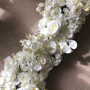 White flower garland runner with roses and small blossoms, floral arch detail