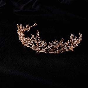 Gold-tone rhinestone bridal tiara with an ornate curved crown