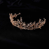 Gold-tone rhinestone bridal tiara with an ornate curved crown