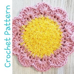 Pink crochet flower dish scrubby with textured yellow center