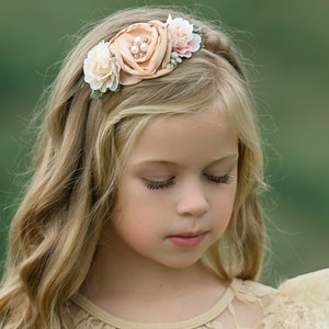 Floral nylon baby headband with fabric flower crown and bow detail