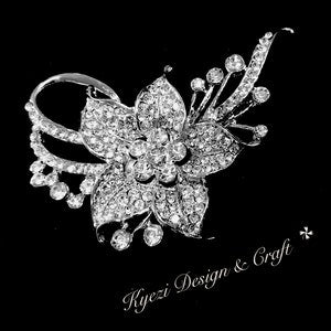 Silver crystal rhinestone flower brooch pin with clear stones, ornate petals