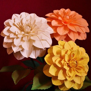 Layered paper flowers template set: cream, orange, and yellow blooms with green leaves