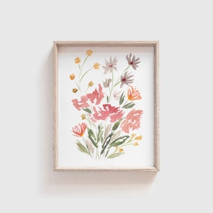 Framed watercolor wildflower art print with pink blossoms, green stems, and small butterfly accents