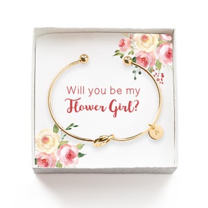 Gold bangle bracelet with heart charm and engraved text “Will you be my Flower Girl?”