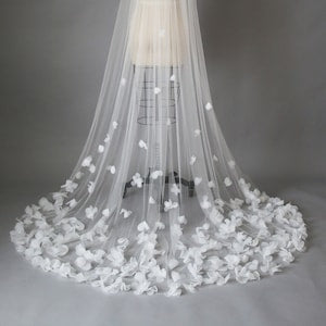 White tulle wedding veil with floral appliques and layered cathedral length