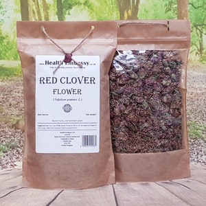 Natural herbal tea blend pouches with red clover flower, kraft bags labeled Health Embassy