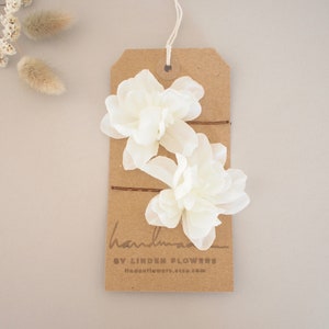 Ivory delphinium hair flower pins set on card, two white floral blooms