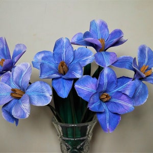 Blue paper tulip flower bouquet in small metal vase