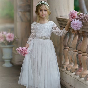 White lace bodice tulle flower girl dress with long sleeves and layered skirt