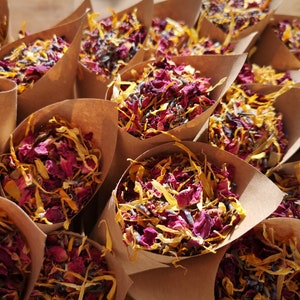 Biodegradable wedding confetti cones filled with dried petals and colorful paper shreds