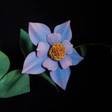 Blue layered paper flower decoration with textured center