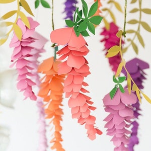 Colorful paper wisteria flower garland with layered petals hanging