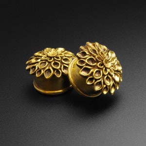 Brass flower double flare ear plug gauges with ornate petal details and rounded flares