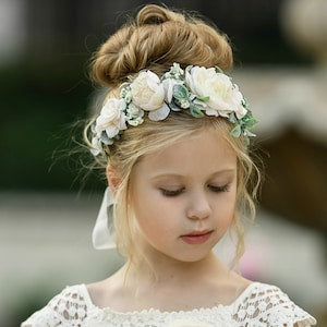 Girls' flower crown headband with white blooms and green leaves, halo style