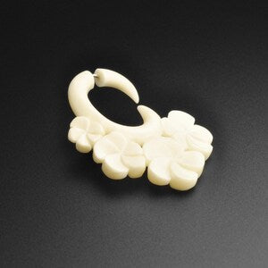 Ivory fake gauge spiral earring with four flower carvings for pierced ears