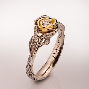 Gold and diamond flower ring with twig leaf band in gold and silver tones