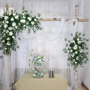 White rose and greenery eucalyptus wedding archway floral arrangement with hanging swags