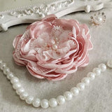 Dusty pink handmade singed fabric rose with pearl accents and pearl bead strand