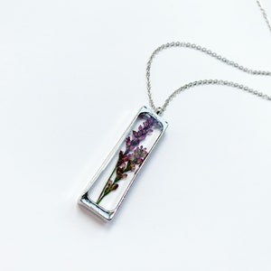 Pressed flower necklace with rectangular stainless pendant and dried lavender flowers