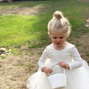 Ivory long-sleeve tulle flower girl dress with gathered skirt and round neckline