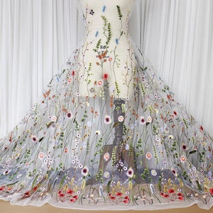 Embroidered tulle lace fabric with multicolor floral motifs and bead accents
