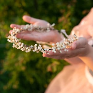 Preserved baby's breath flower crown with small white and pink blooms