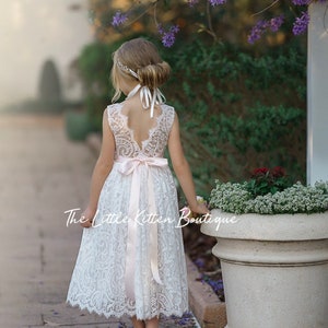 Back view lace flower girl dress with ribbon tie, sleeveless white embroidered bodice
