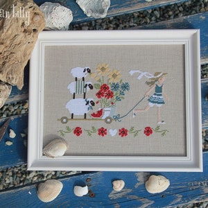 Framed floral beach embroidery wall art with sailboat and flowers, white border