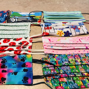 Set of colorful printed fabric face masks with animal and pattern designs