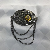 Very nice brooch with abstract resin flower designs and colorless rhinestones.