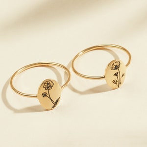 Gold-tone signet rings with delicate flower engraving, adjustable band pair
