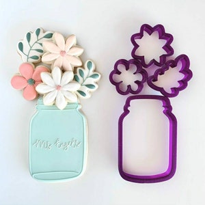 Mason jar cookie cutters with flower and leaf designs, purple and mint