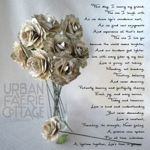 Cream paper rose bouquet with small green leaves, paired with handwritten vow text