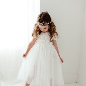 White lace bodice tulle flower girl dress with cap sleeves and matching headband