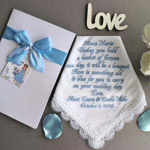 Personalized flower girl handkerchief with white lace trim and blue satin bow