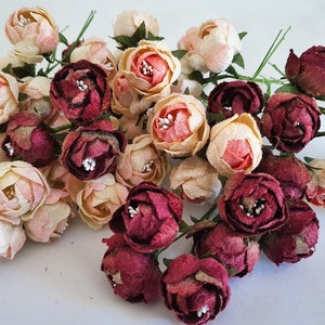 Assorted velvet millinery roses in cream, blush pink, and dark burgundy