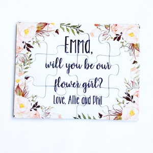 Custom jigsaw puzzle with floral border and 'Emma, will you be our flower girl?'