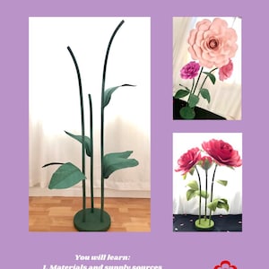 Tall black paper flower stems with green leaves and pink giant blossoms in vase