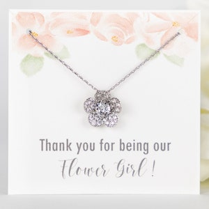 Flower girl necklace with silver chain and glitter flower pendant, on thank-you card