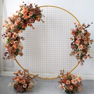 Round arch wedding flower garland with peach, terracotta and rust orange blooms