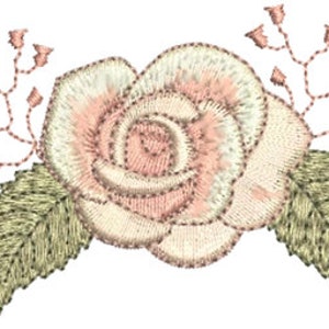 Rose embroidery motif by Sue Box with green leaves