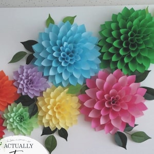 Set of giant paper wall flowers in blue, green, pink, yellow, purple, and orange with leaves